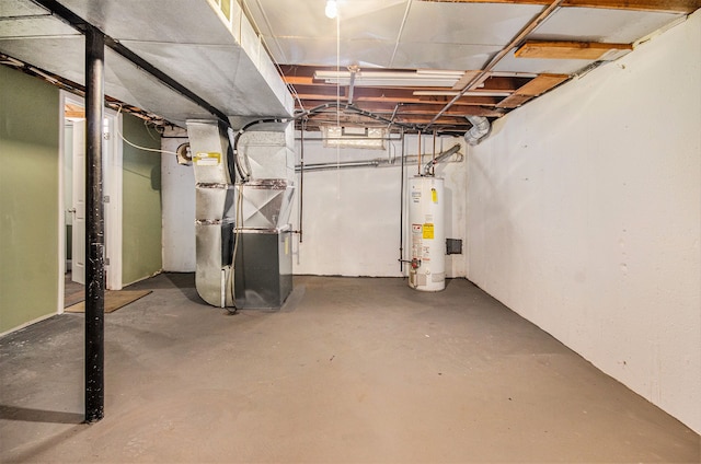 basement featuring heating unit and gas water heater