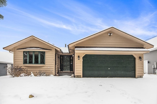 ranch-style home featuring a garage