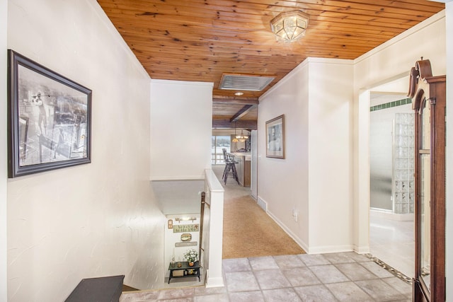 corridor featuring ornamental molding and wood ceiling