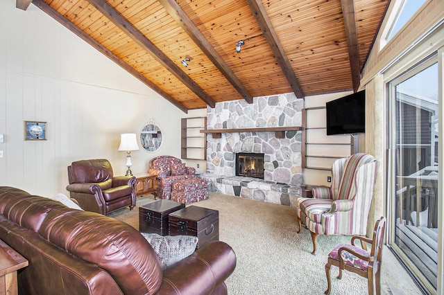 living room with carpet, a stone fireplace, wood walls, lofted ceiling with beams, and wooden ceiling