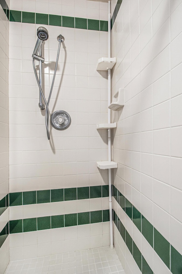 bathroom with a tile shower