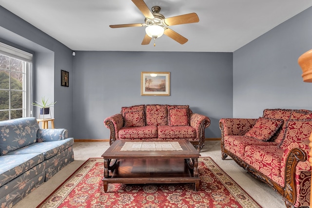 living room with ceiling fan and light colored carpet