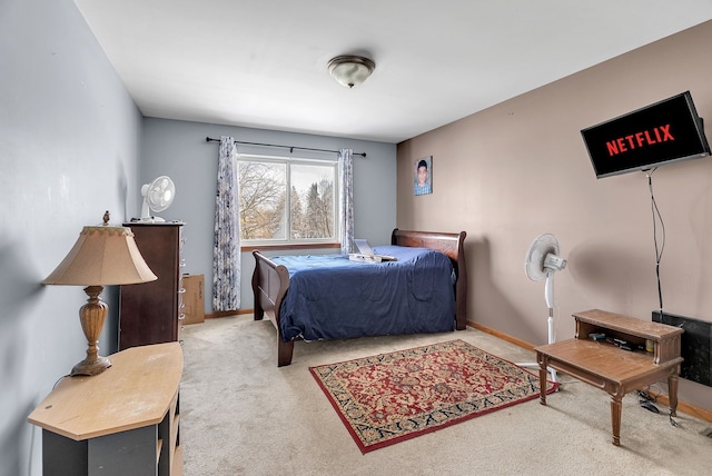 bedroom with light colored carpet