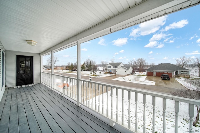 view of snow covered deck