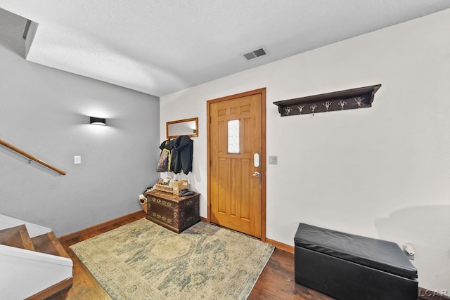 entrance foyer with dark wood-type flooring