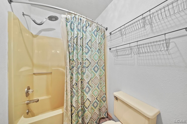 bathroom featuring toilet and shower / tub combo