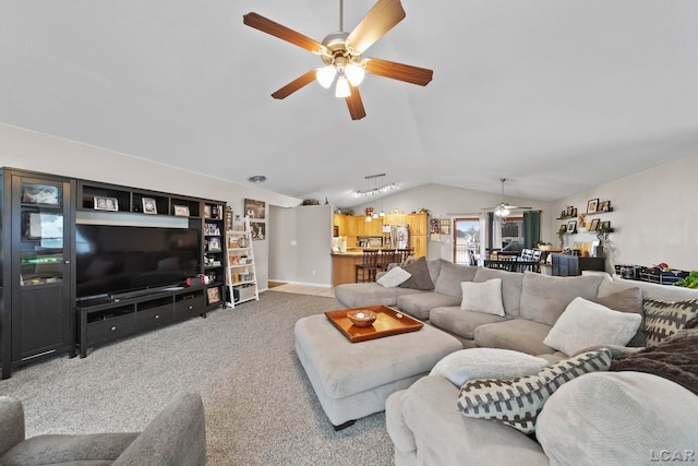 carpeted living room with ceiling fan and lofted ceiling