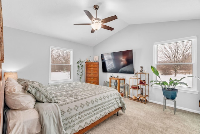 carpeted bedroom featuring ceiling fan and vaulted ceiling