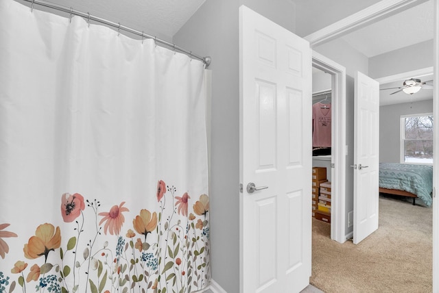 bathroom featuring ceiling fan