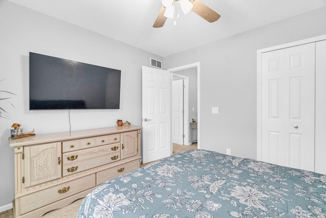 bedroom with ceiling fan and a closet