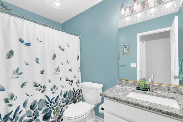 bathroom with a textured ceiling, toilet, vanity, and a shower with shower curtain