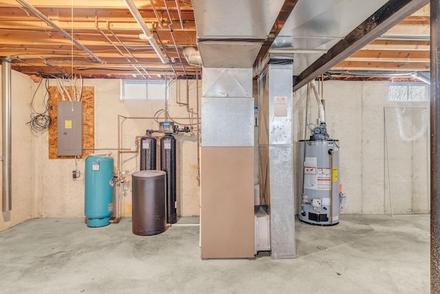 basement with water heater and electric panel