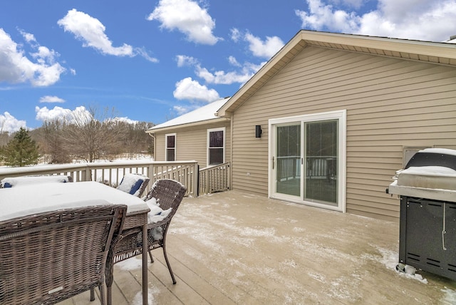 snow covered deck with area for grilling