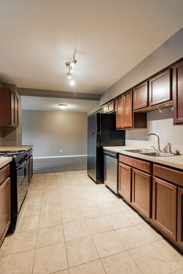 kitchen featuring rail lighting, sink, light tile patterned floors, and black appliances