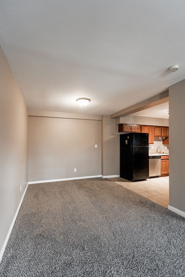 unfurnished living room with light colored carpet