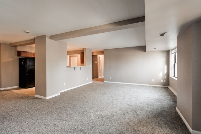 unfurnished living room with light colored carpet