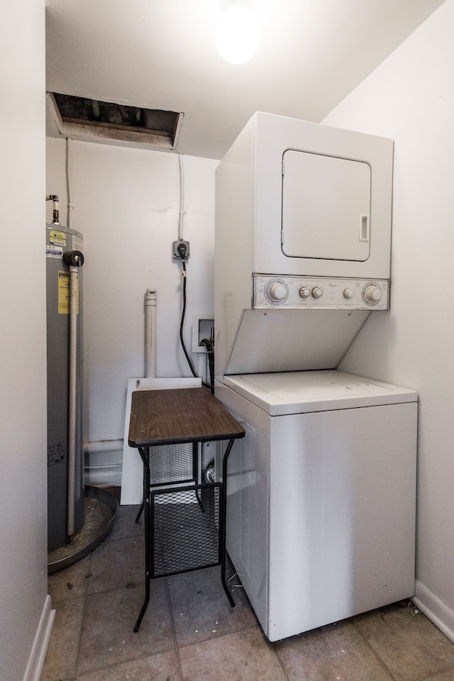 laundry area featuring stacked washer and clothes dryer and water heater