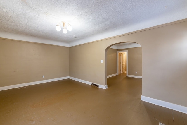 empty room featuring a textured ceiling