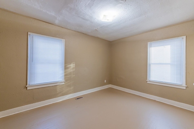 empty room featuring a textured ceiling