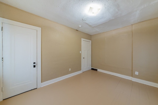 unfurnished bedroom featuring a textured ceiling