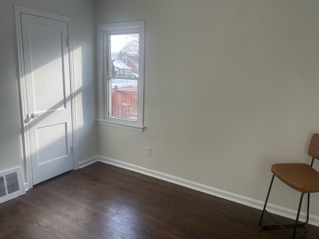 empty room featuring dark hardwood / wood-style floors