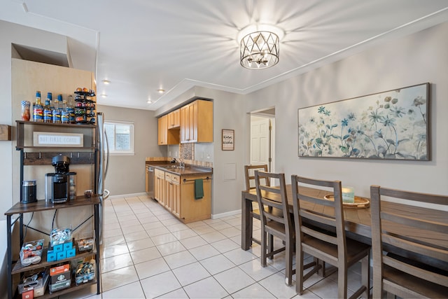 kitchen with sink, light tile patterned floors, decorative backsplash, and dishwasher