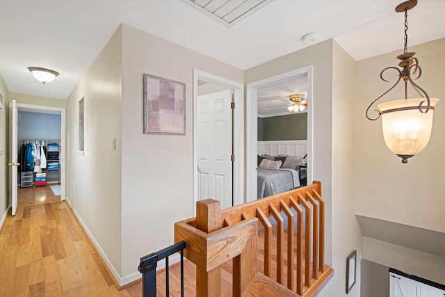 corridor featuring light hardwood / wood-style floors