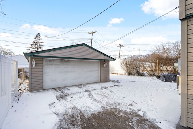 view of snow covered garage