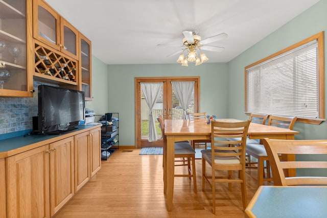 dining area featuring ceiling fan and light hardwood / wood-style floors