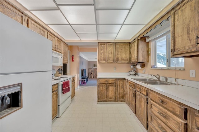 kitchen with sink and white appliances