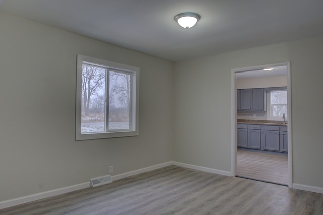 unfurnished room featuring light hardwood / wood-style flooring