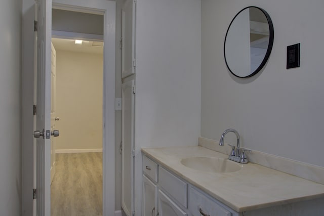 bathroom featuring vanity and hardwood / wood-style flooring