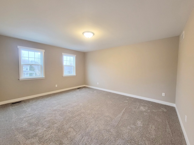 empty room featuring carpet floors