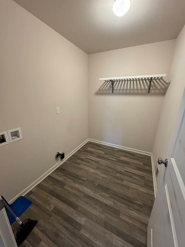 laundry area featuring dark wood-type flooring and washer hookup