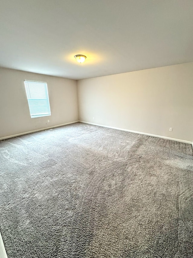 unfurnished room with carpet floors