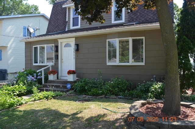 1511 Bernice Ave, Saint Joseph, MI 49085 - view of front of home featuring a shingled roof and a front lawn