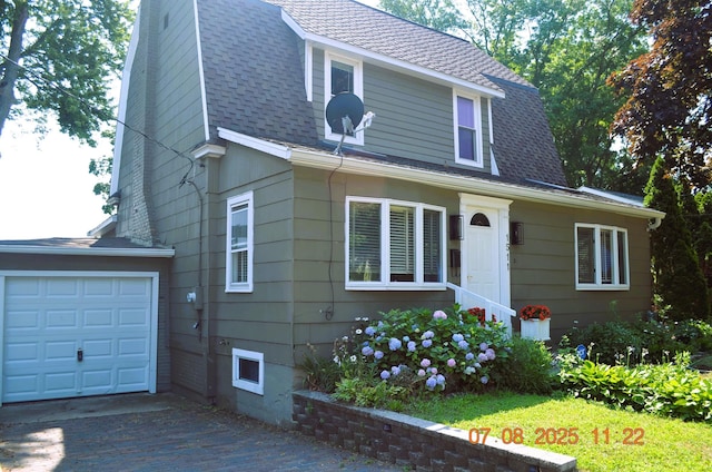 1511 Bernice Ave, Saint Joseph, MI 49085 - view of front facade with driveway, roof with shingles, and an attached garage