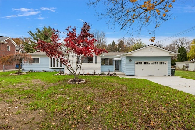 ranch-style house featuring a garage and a front lawn