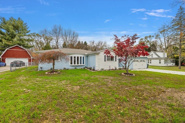 view of front of home with a front lawn and a garage