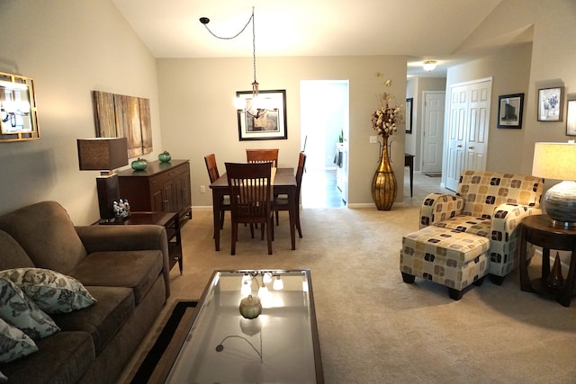 living room with baseboards, light carpet, and vaulted ceiling