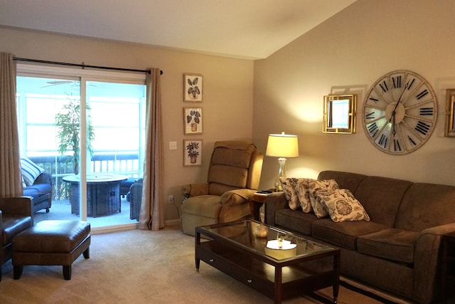 living room with light colored carpet and vaulted ceiling