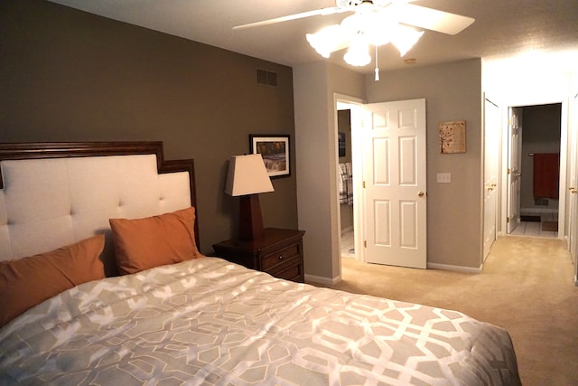 bedroom featuring ceiling fan and light carpet