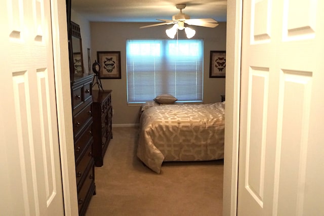 carpeted bedroom with ceiling fan