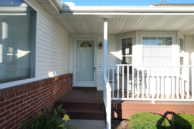 doorway to property featuring a porch