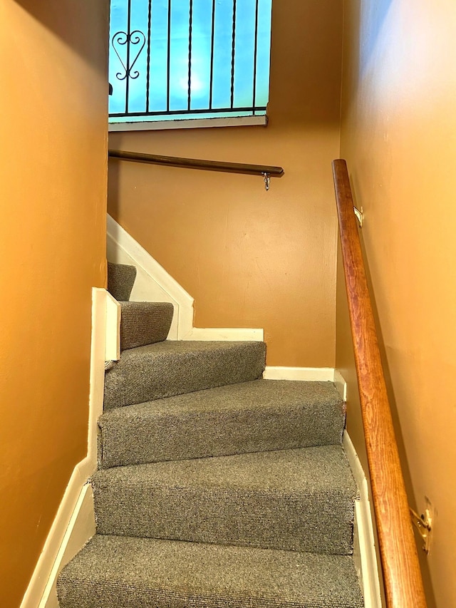 staircase with baseboards