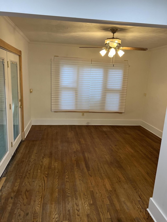 interior space featuring crown molding, ceiling fan, and dark wood-type flooring