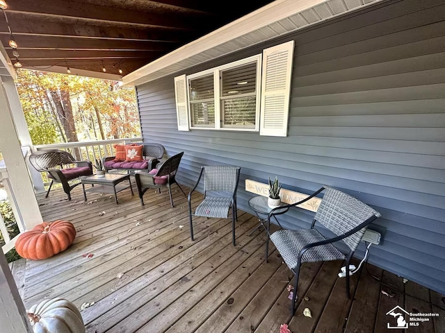 wooden deck with outdoor lounge area