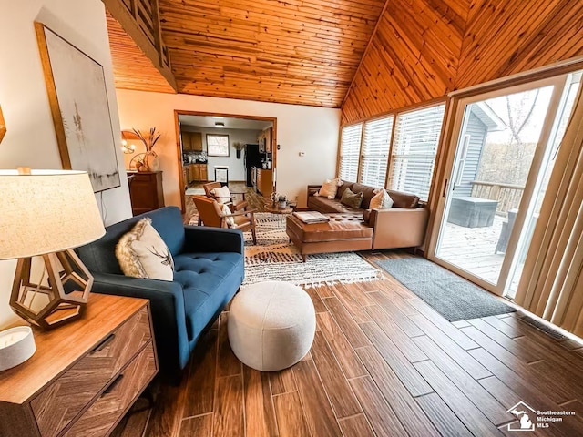 living room with wooden ceiling and high vaulted ceiling