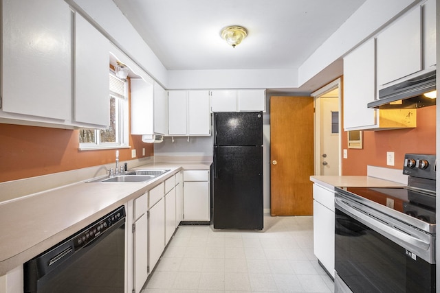 kitchen with dishwashing machine, black fridge, stainless steel electric range, white cabinets, and sink