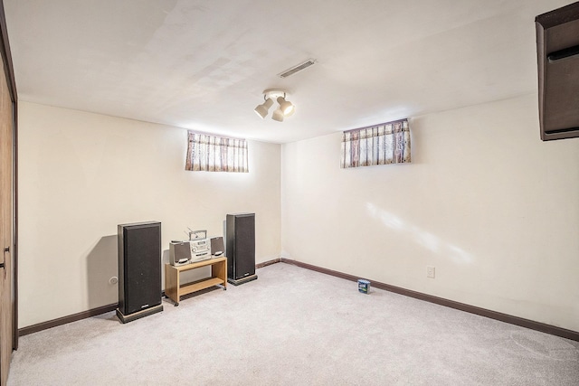 basement with light colored carpet